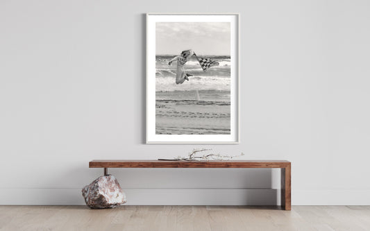 Dynamic Start at TROG: Adrenaline-Packed Flag Girl Soars Over Beach - Breathtaking Black & White Energy Photo Poster Print